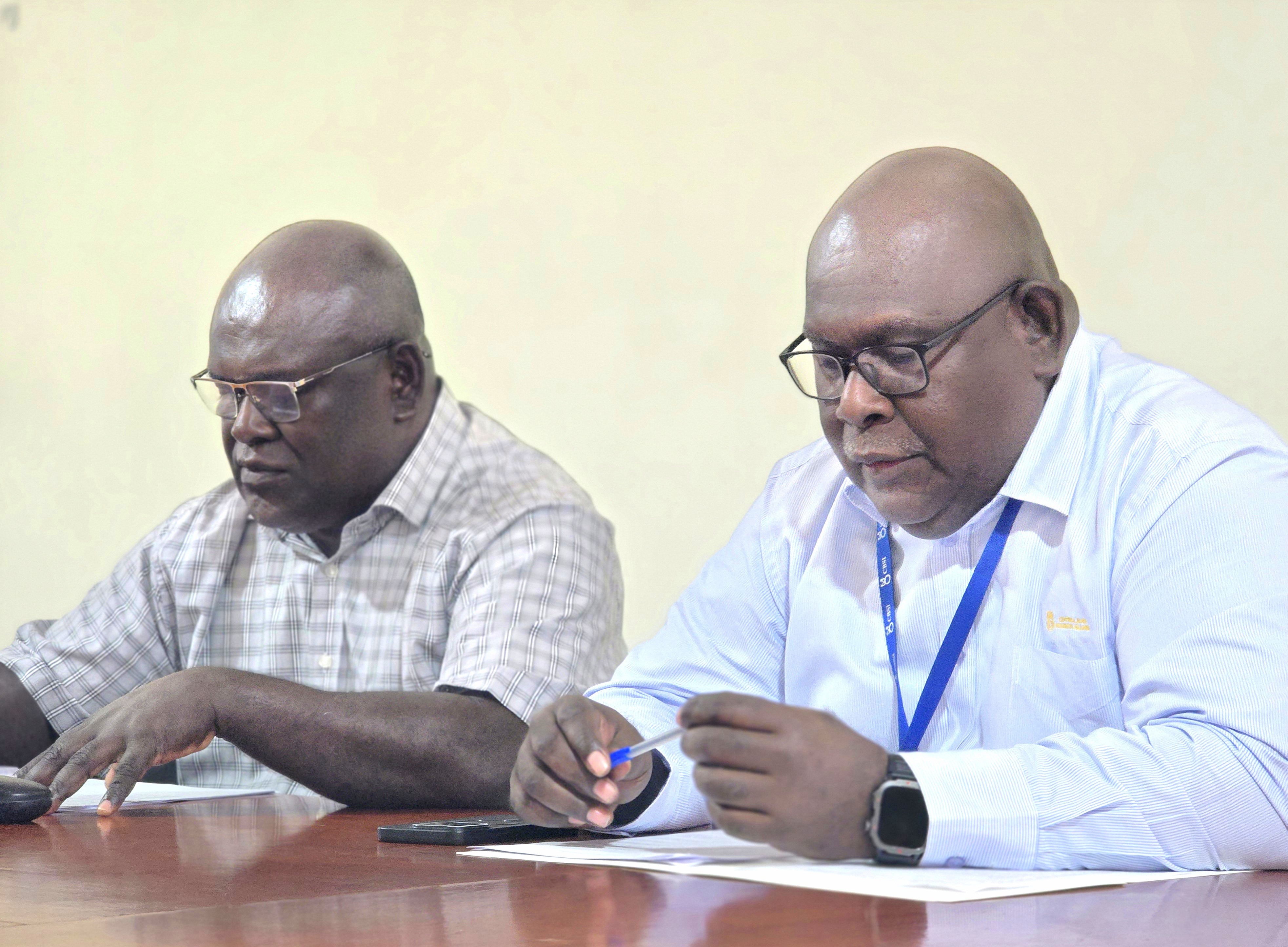 Deputy Governor of CBSI Raynold Moveni (right) Hon. Minister MCILI/ Hon. Minister MOFT - Harry Kuma (left) 